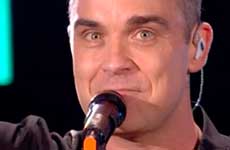 Robbie Williams desinfectó sus manos luego de tocar a fans