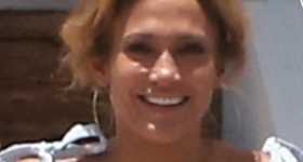 Jennifer Lopez sonriendo feliz con Ben Affleck en Miami