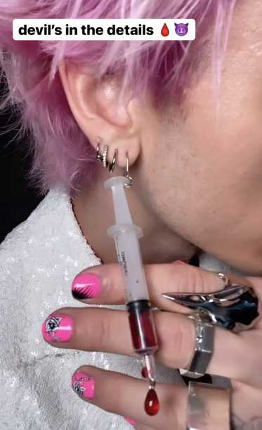 machine gun kelly syringe earring blood